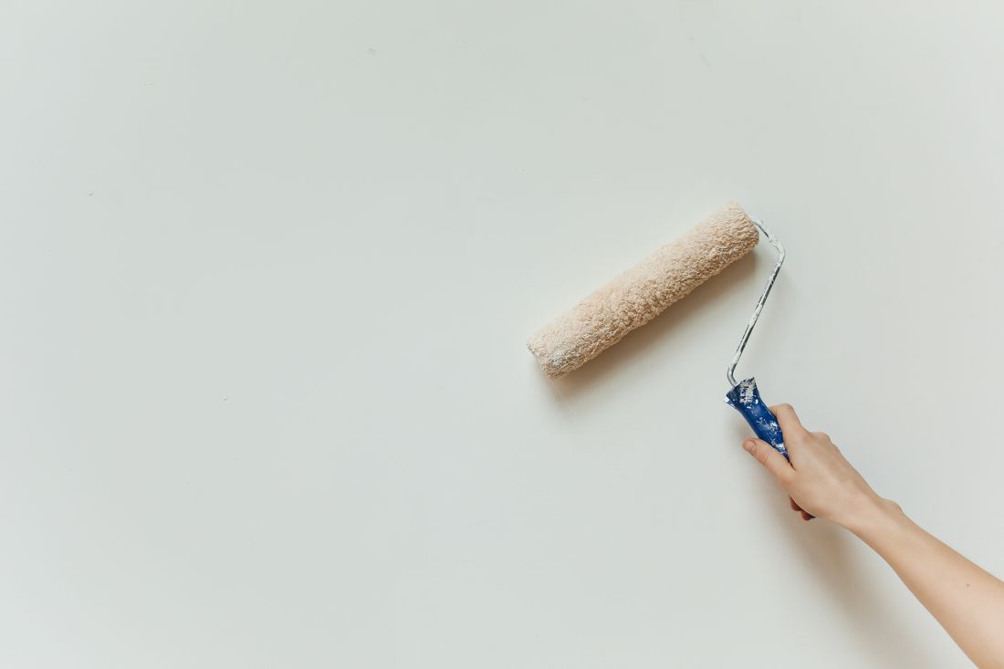 A roller laying a clean coat of paint